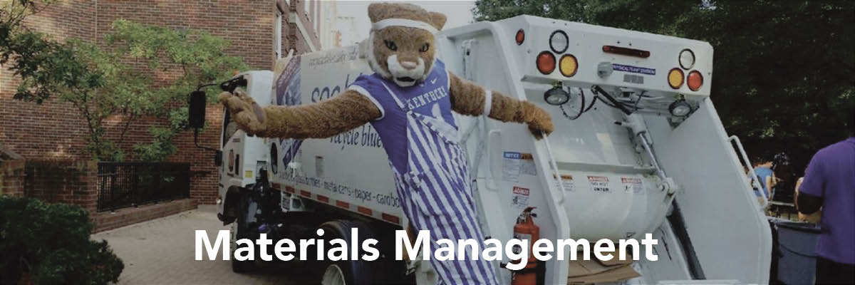 The UK Mascot hanging off the back of a garbage truck. At the bottom of the image is text that reads "Materials Management"