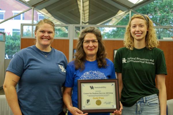Group of three Martin Gatton College of Agriculture, Food and Environment staff receiving Sustainable Office Certification. 
