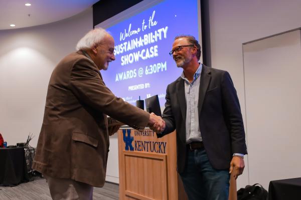 Men shaking hands at awards ceremony