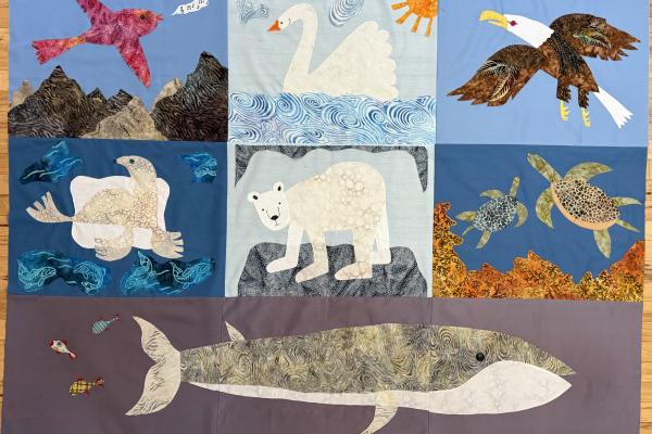 A quilt composed of squares of animas affected by climate change: birds, fish, bears, and turtles