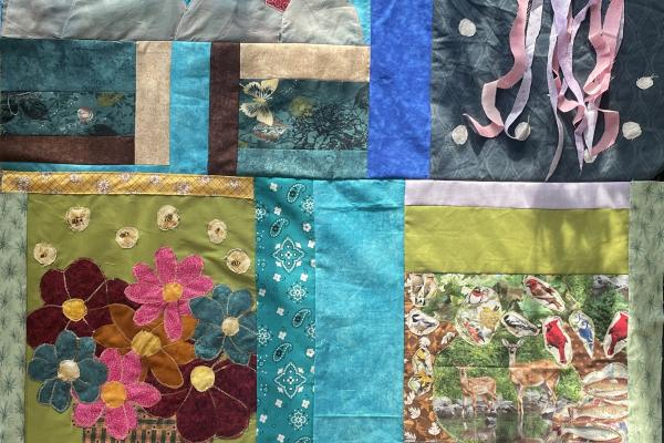 quilt patch including a coral reef, jellyfish, vase of flowers, and woodland scene