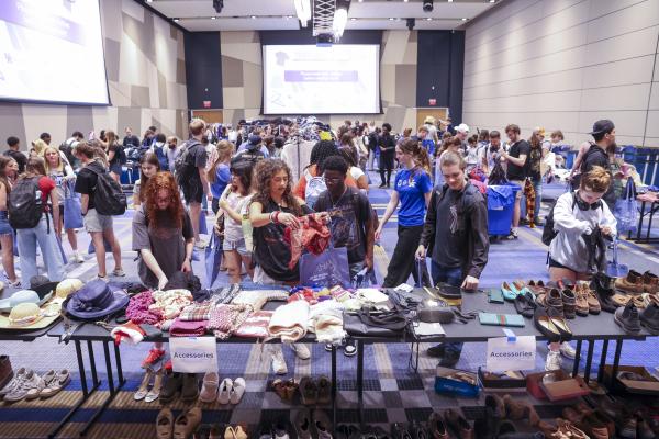 Students browse clothes at the pop up thrift shop event