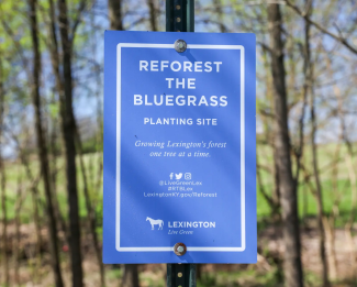 Reforest the Bluegrass sign at planting site
