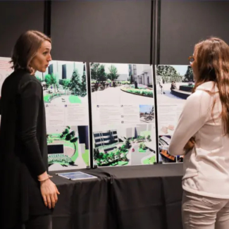 Student presenting research poster