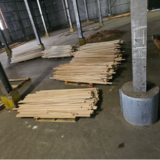 wood laying on ground at site 