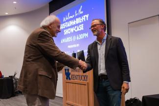 Men shaking hands at awards ceremony