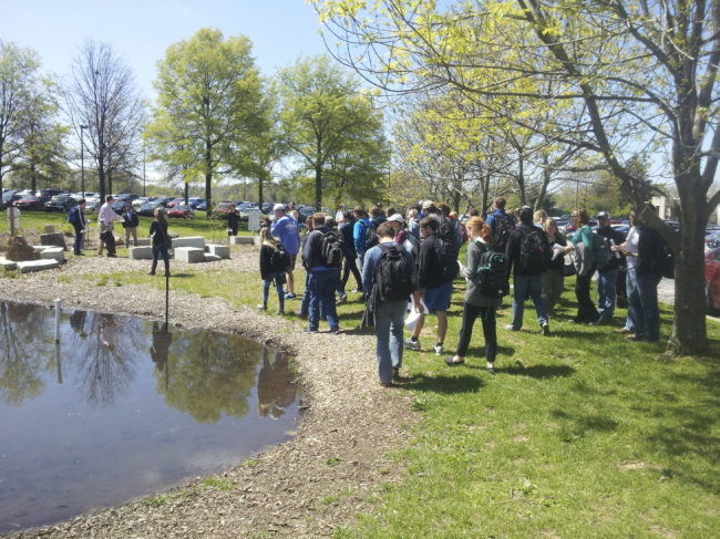 Students from PLS366 (Fundamentals of Soil Science) stand at the Rain Garden.