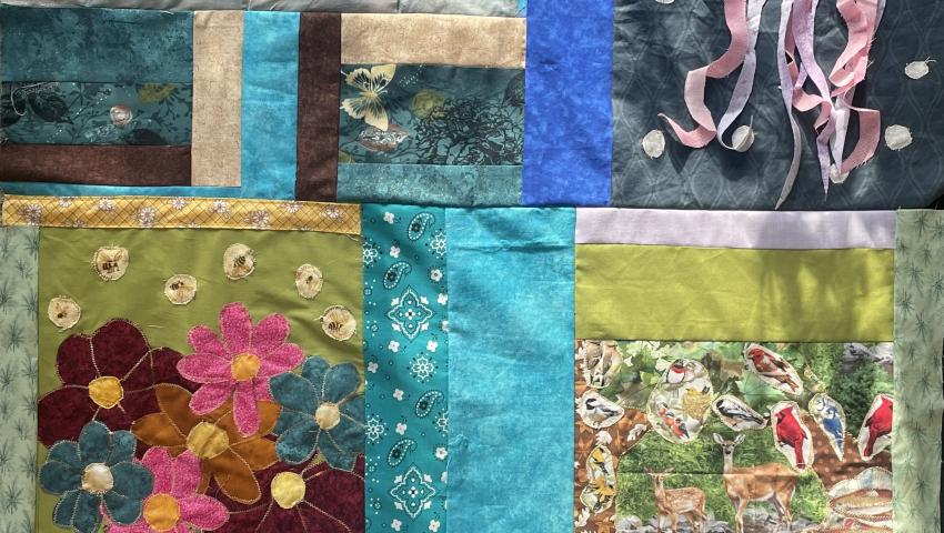 quilt patch including a coral reef, jellyfish, vase of flowers, and woodland scene