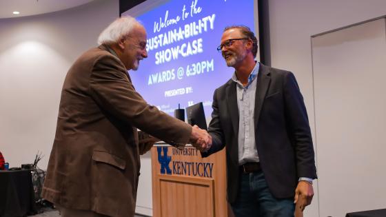 Men shaking hands at awards ceremony
